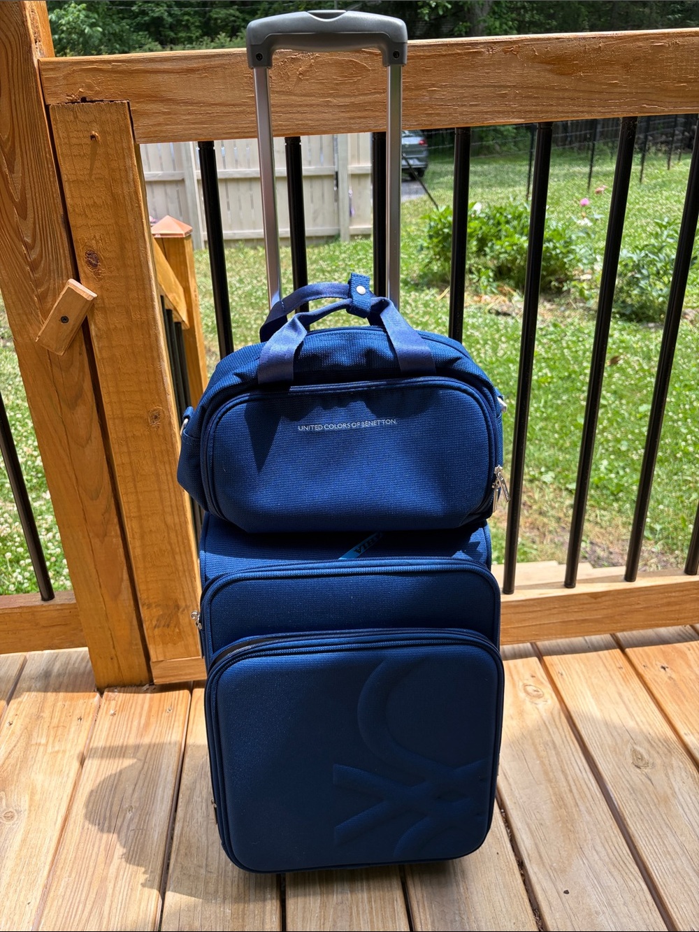United Colors Of Benetton light Blue Softside Carry-On with Telescoping Handle
